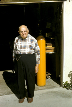 Frederick DeVoe at entrance to his garage (glass-blowing workshop) at his home in Buena Park, California, November 1960