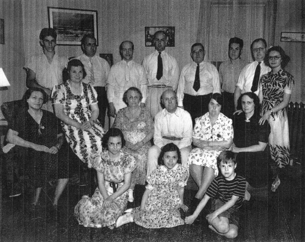 Family picture, possibly at time of John Herbert DeVoe and Edith Tompkins 50th wedding anniversary. Scanned copy sent April 2004 by Sandra M. DeVoe. 
 
Move the cursor over the image to see the name of each individual. (The descriptions are those of Sandra DeVoe.) Click on a person to open the page for that person.