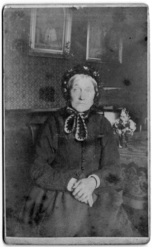 Possibly Isabella Robertson. No wedding ring is visible, but close examination shows a hint of the impression of one that has been cut off. The black bonnet indicates she was a widow. (Conversation with Margaret Troupe and Anne Wynn, 28 May 2003.)