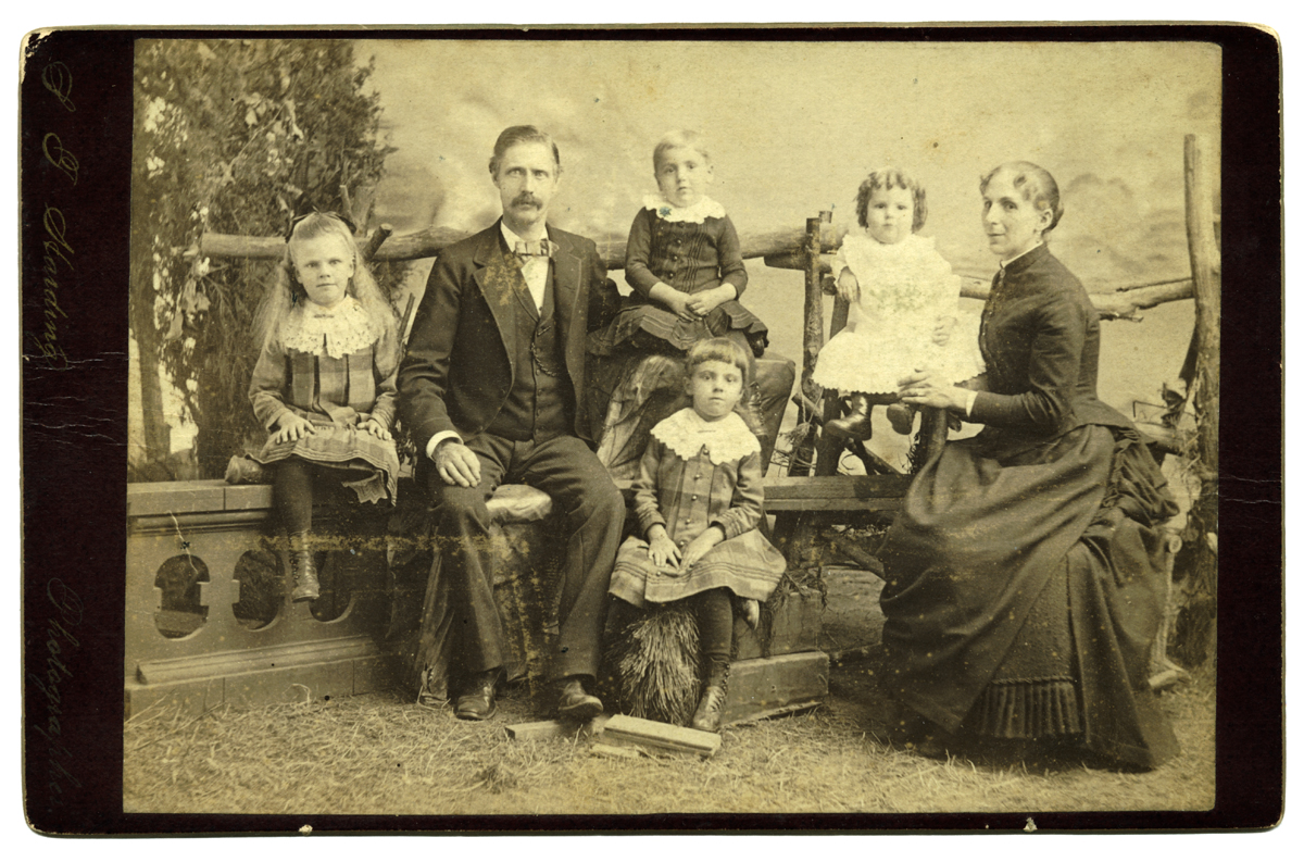 Print, 14.1 cm x 10.1 cm, mounted on card, 16.4 cm x 10.6 cm.  At left edge: "S. F. Harding Photographer".  Photo provided by Margaret Troupe, May 2003, borrowed from the estate of Toby Harrison, a descendant of John Bruce Troup. 
 
Move the cursor over the image to see the name of each individual. Click on a person to open the page for that person. 
 
Marion DeVoe gave another copy of this print to Nancy (DeVoe) Webert, and identified the persons in it.